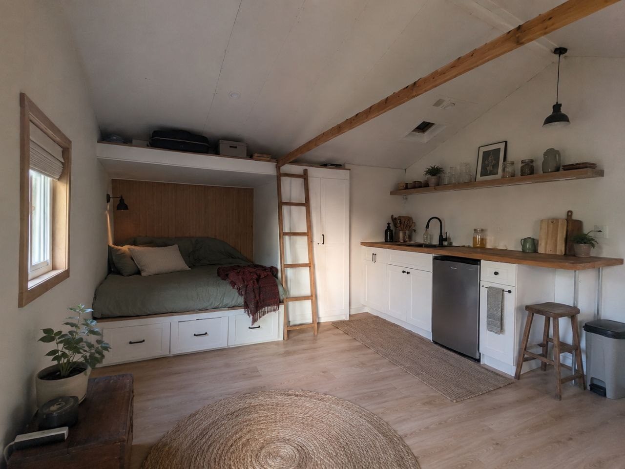 ADU after finish work — furnished living space with kitchenette and loft bed