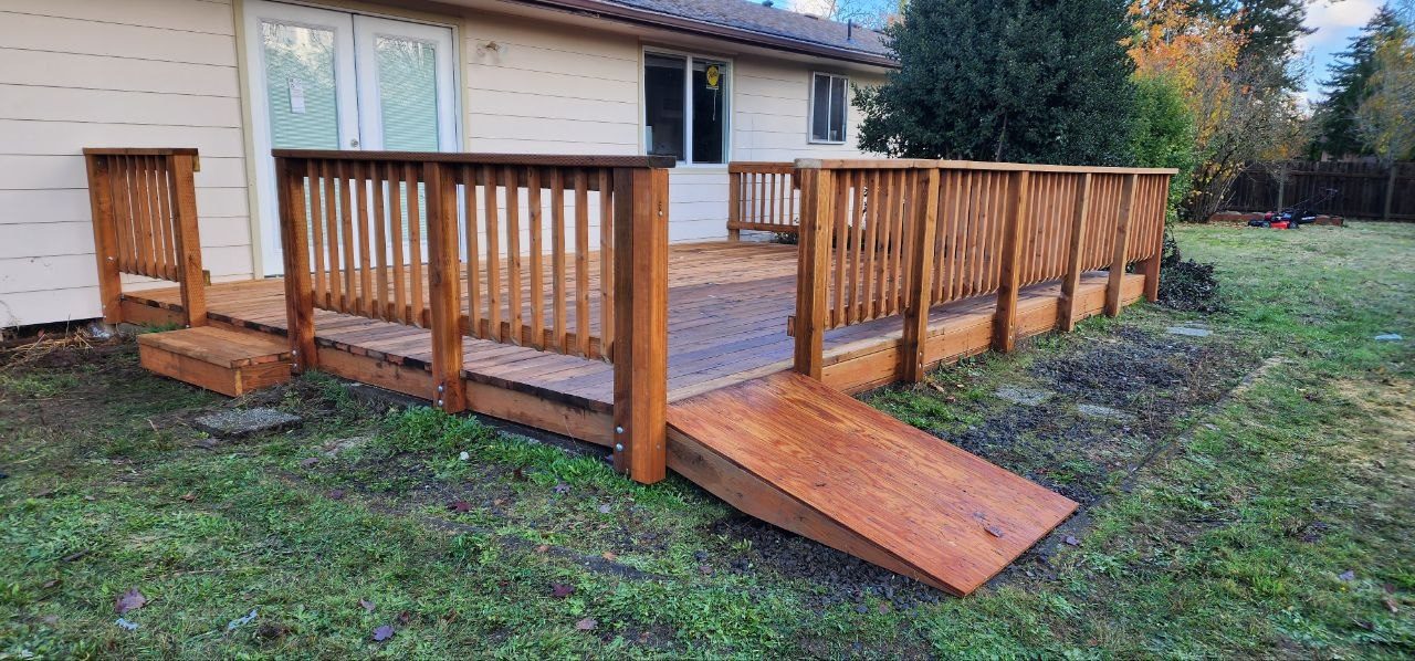 Back deck after remodel — finished decking, railing, and ramp