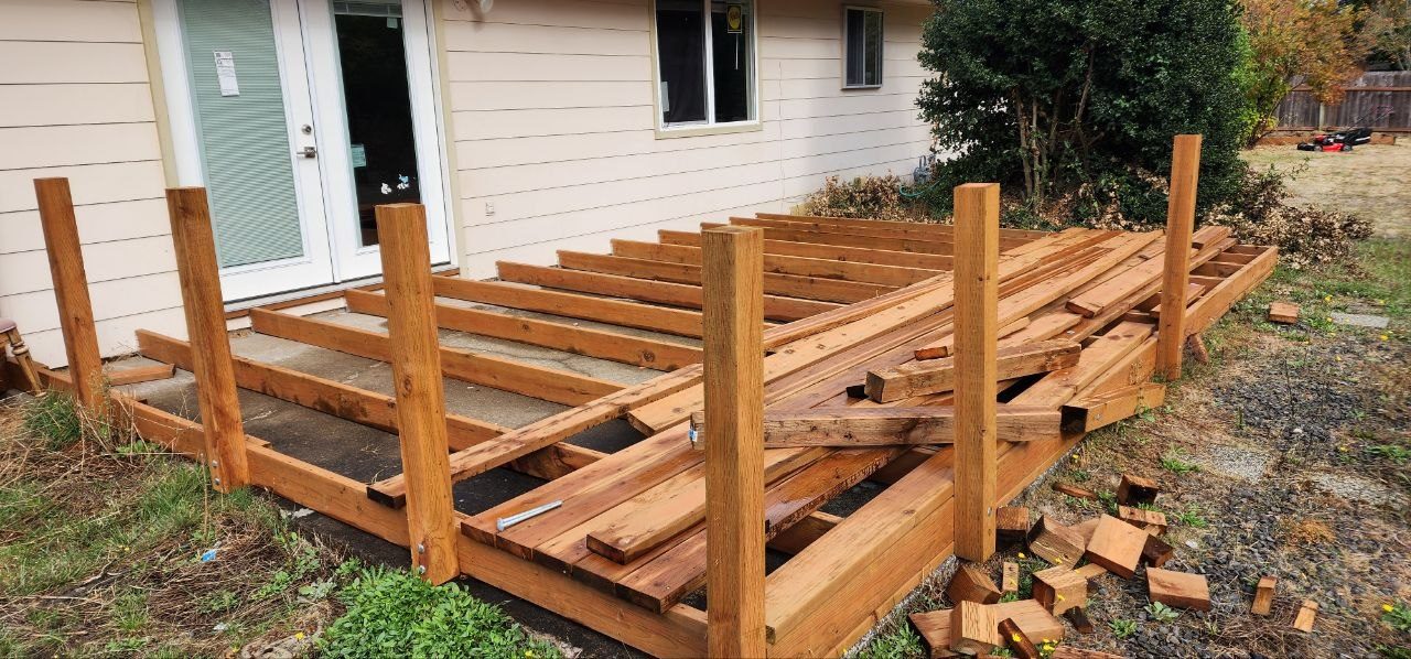 Back deck before remodel — bare framing and joists