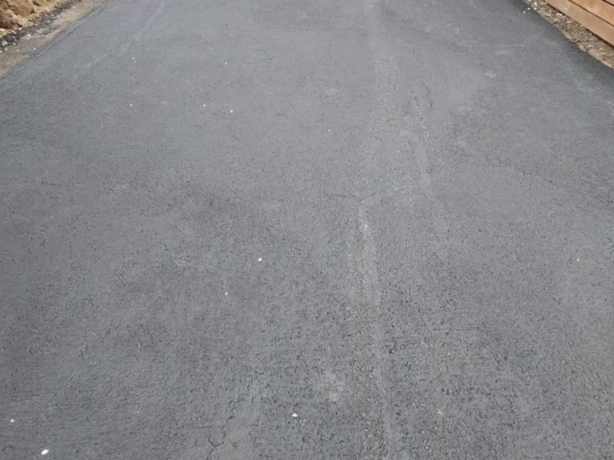 Driveway after fresh asphalt resurfacing