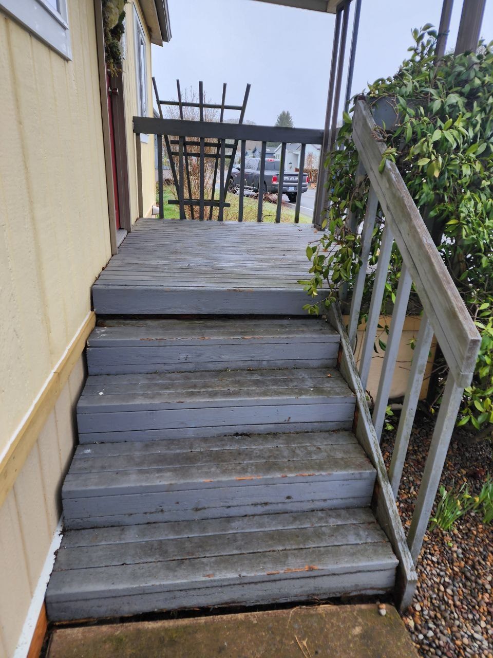 Front porch stairs before remodel — weathered gray paint and worn treads